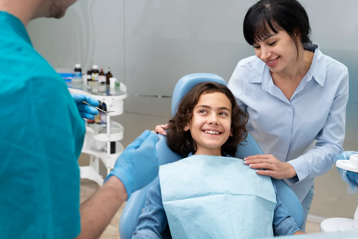 Dentist discussing a child's routine dental check-up