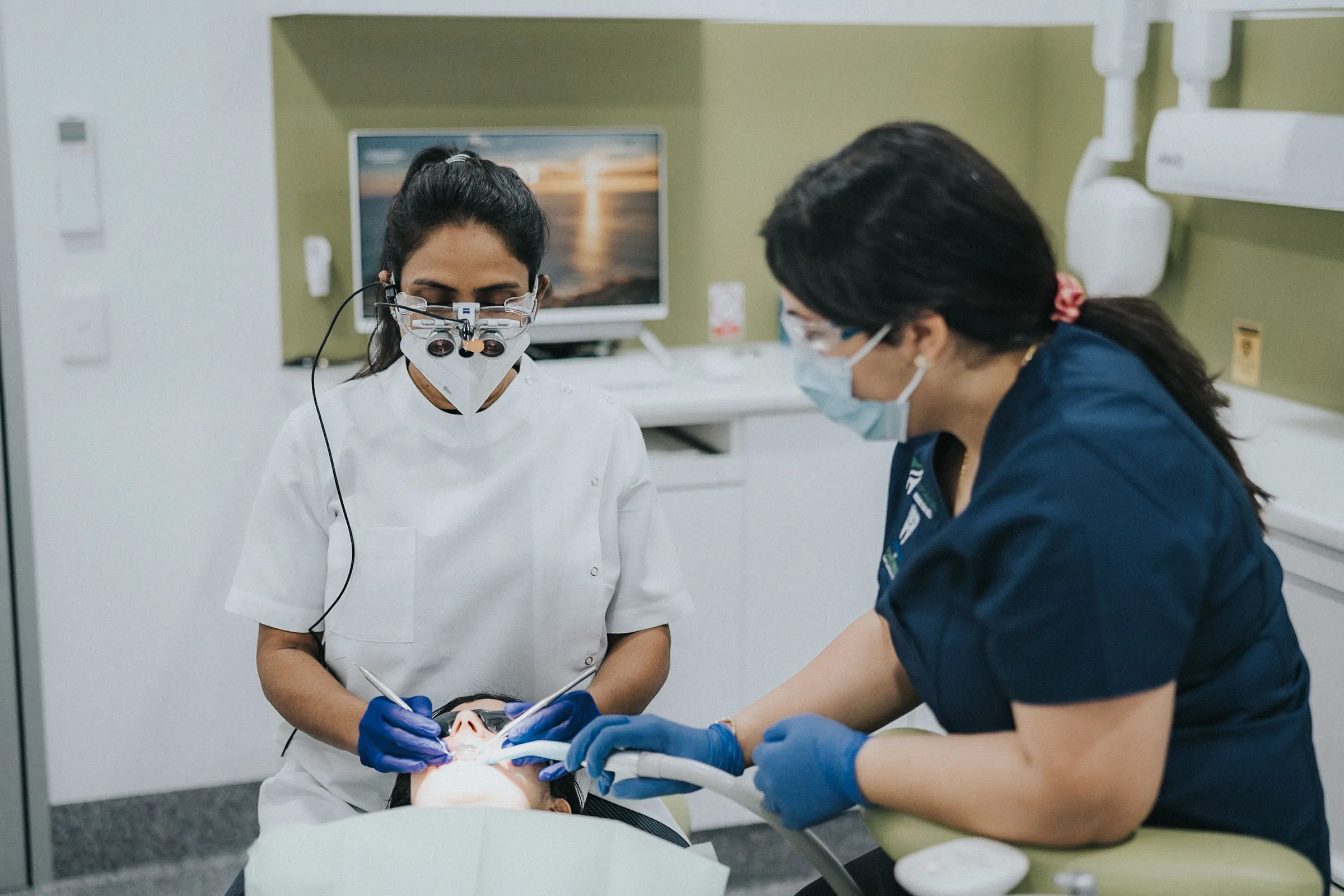 Dentist listening to a patient with an urgent dental concern