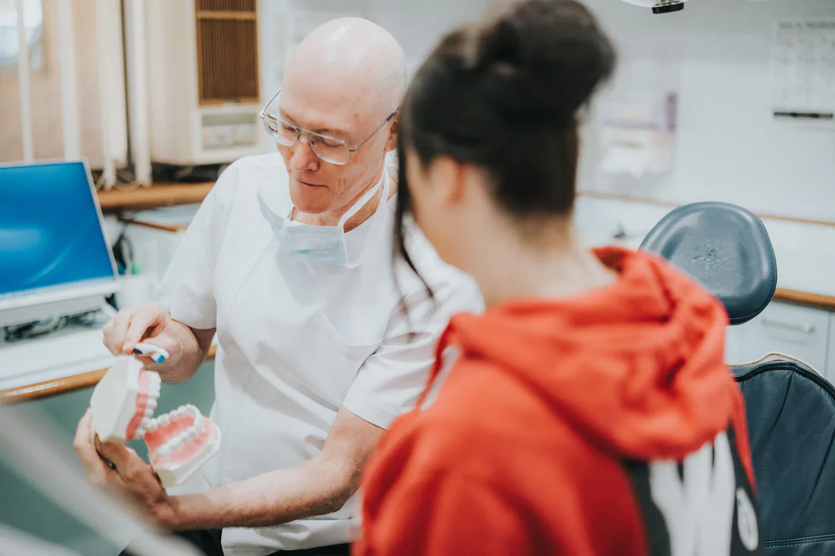 Dentist discussing preventive dental care with a patient